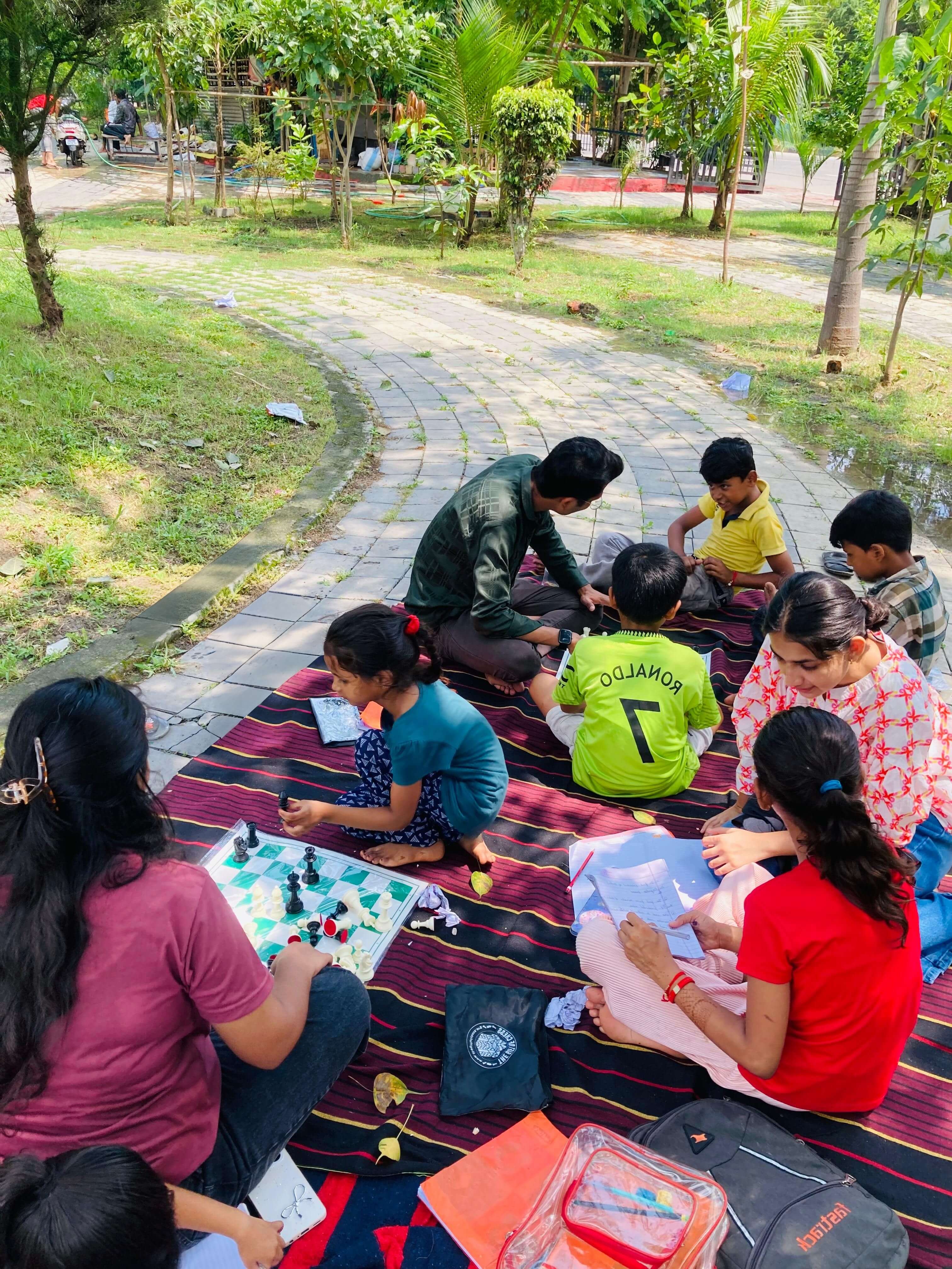 Volunteers supporting children in a community learning session
