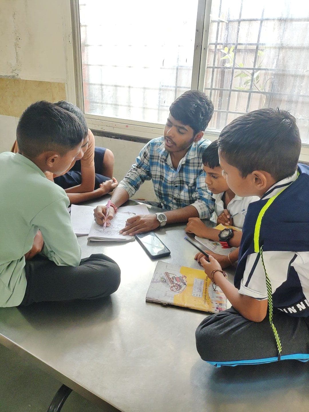 Volunteer helping a child with homework