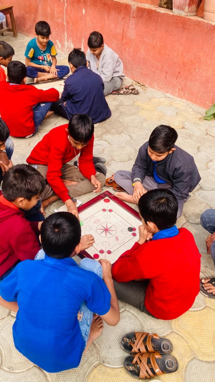 Children playing carrom